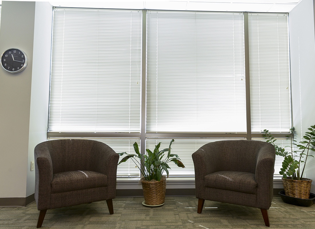Blog - View of Two Waiting Chairs Next to Windows Inside the Arbor Insurance Group Office